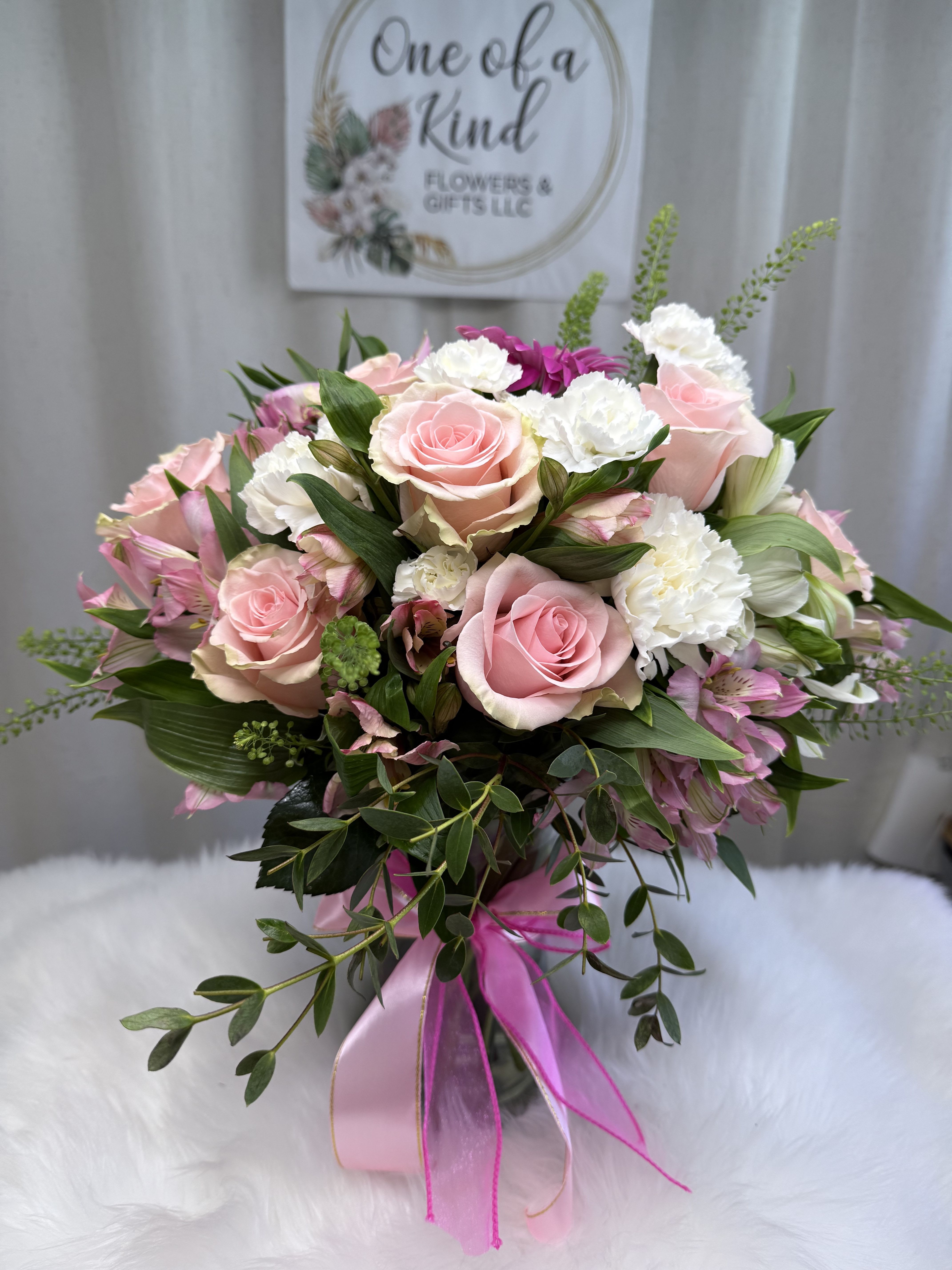 Pink and white rose bouquet with ribbon