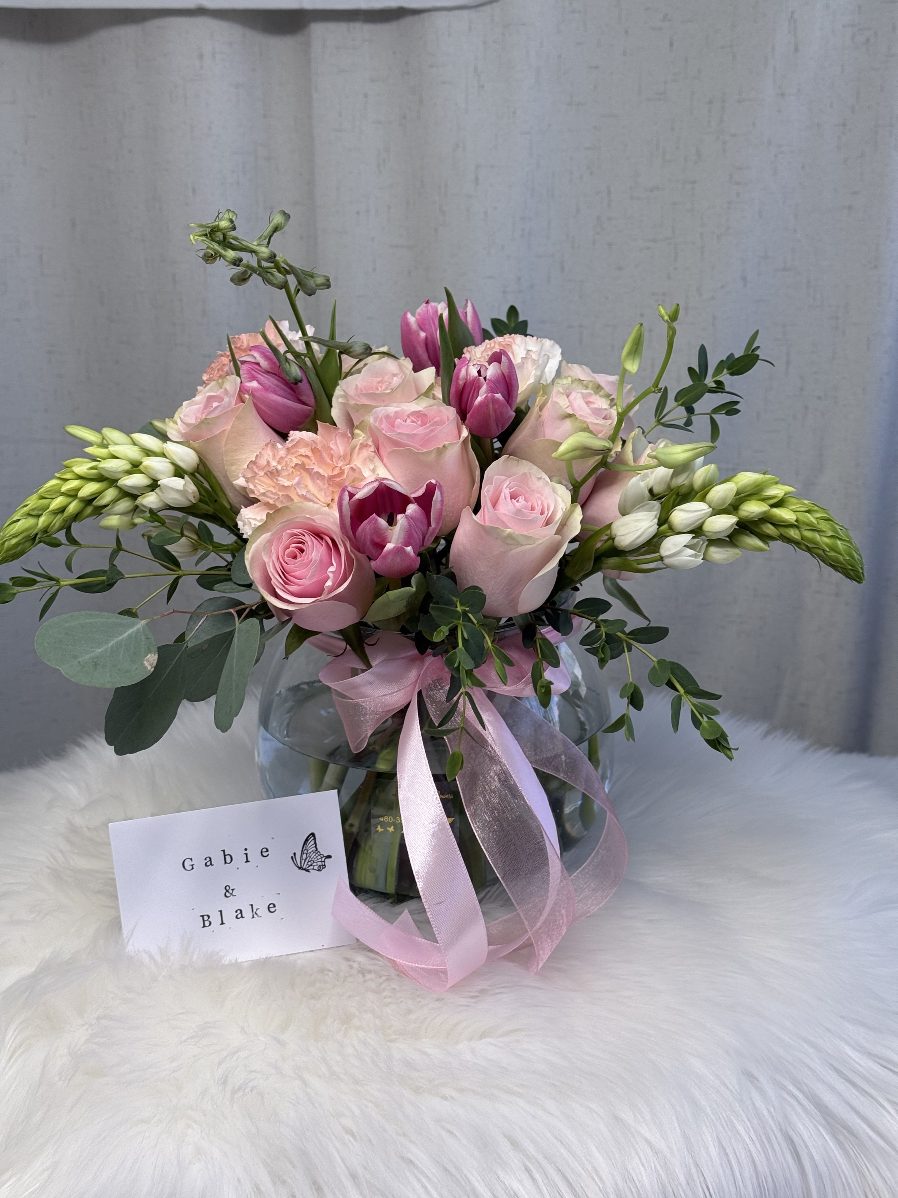 Sweetness - A delicate floral arrangement that blends the elegance of fresh blooms with the softness of pink tulips. Its romantic tones create a light, feminine, and charming composition—perfect for expressing love, sweetness, and heartfelt wishes.  