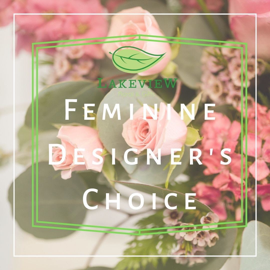 Pink roses and small pink flowers with eucalyptus in a floral design