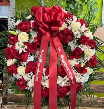 Red and White Sympathy wreath - red and white medium sympathy wreath  mixture of roses, carnations, and lilies  with filler flowers and greenery. 
