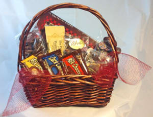 Basket of assorted chocolates wrapped in red mesh