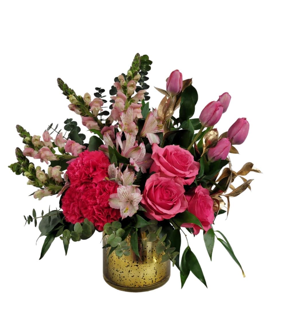 Pink roses and carnations in a gold vase with mixed greenery