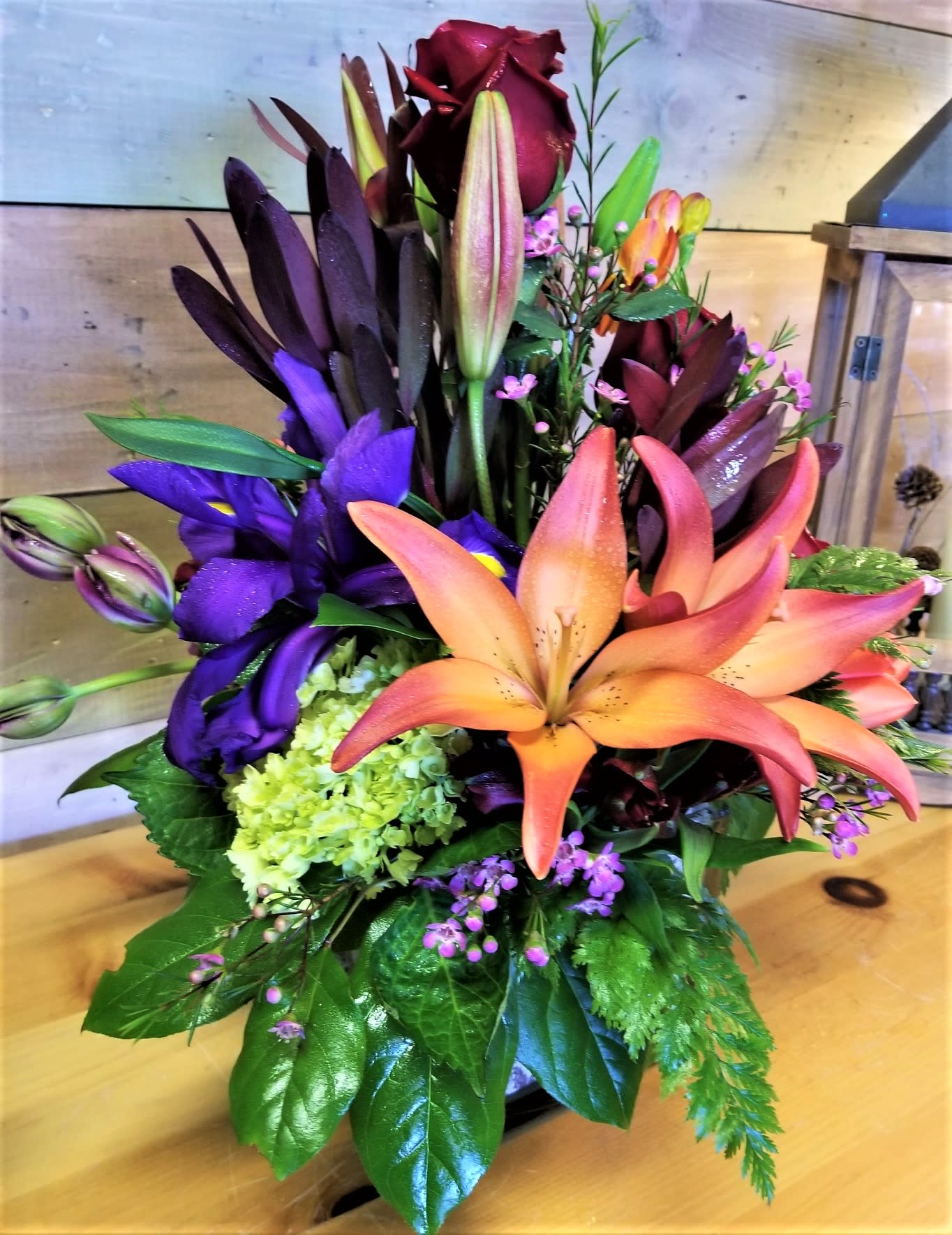 Midnight Magic -  Lilies, purple Iris, Roses, Tulips,  flowers may vary with seasonal availability 