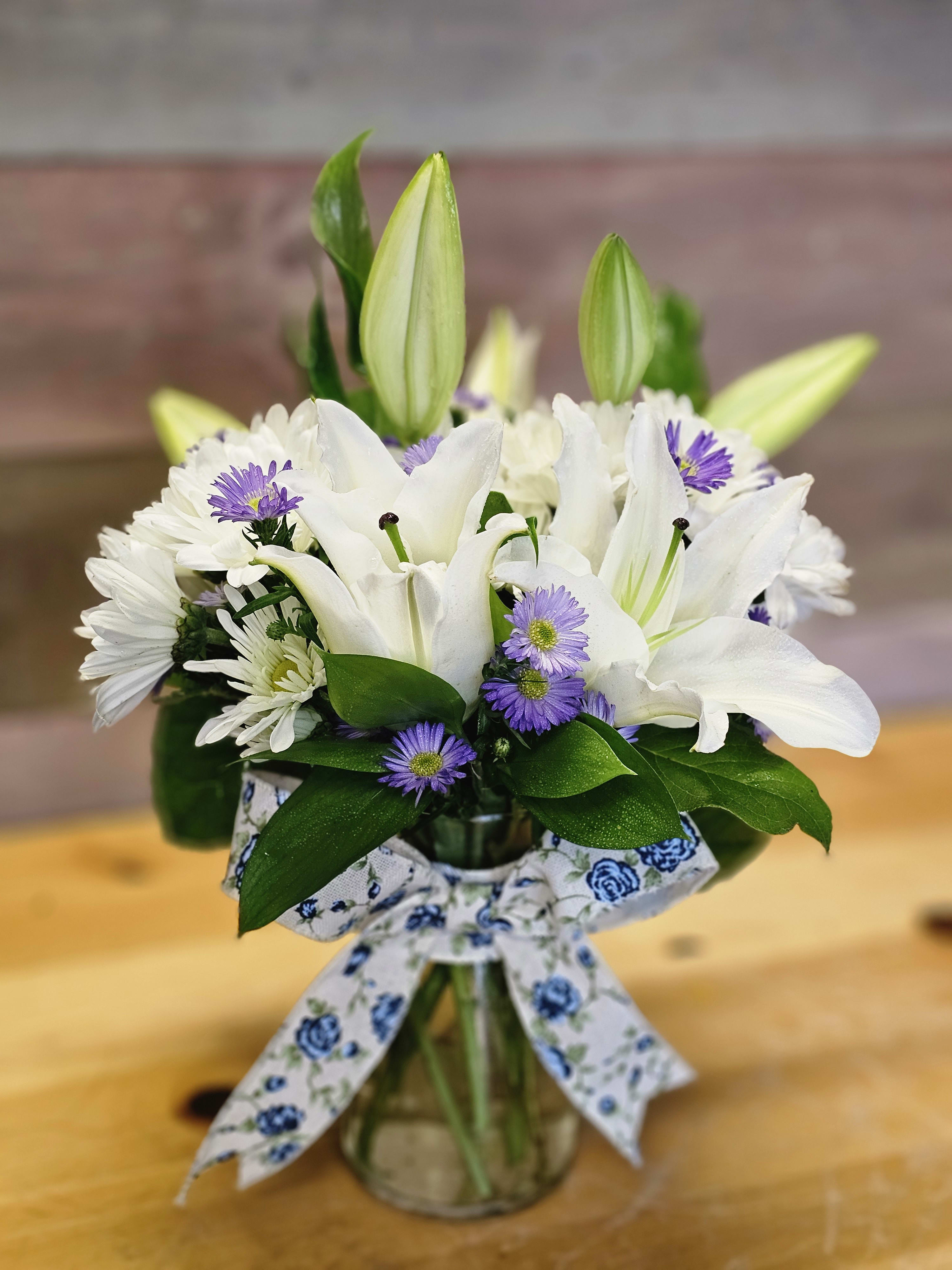 Giving Peace - This thoughtful arrangement is beautiful and makes a statement of Peace. For any occasion.  Colors will vary and flowers can vary with season and availability. 