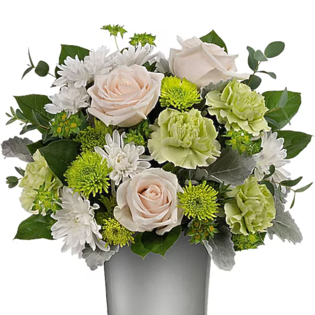 Bouquet of pale roses, green carnations, and white daisies in a gray vase