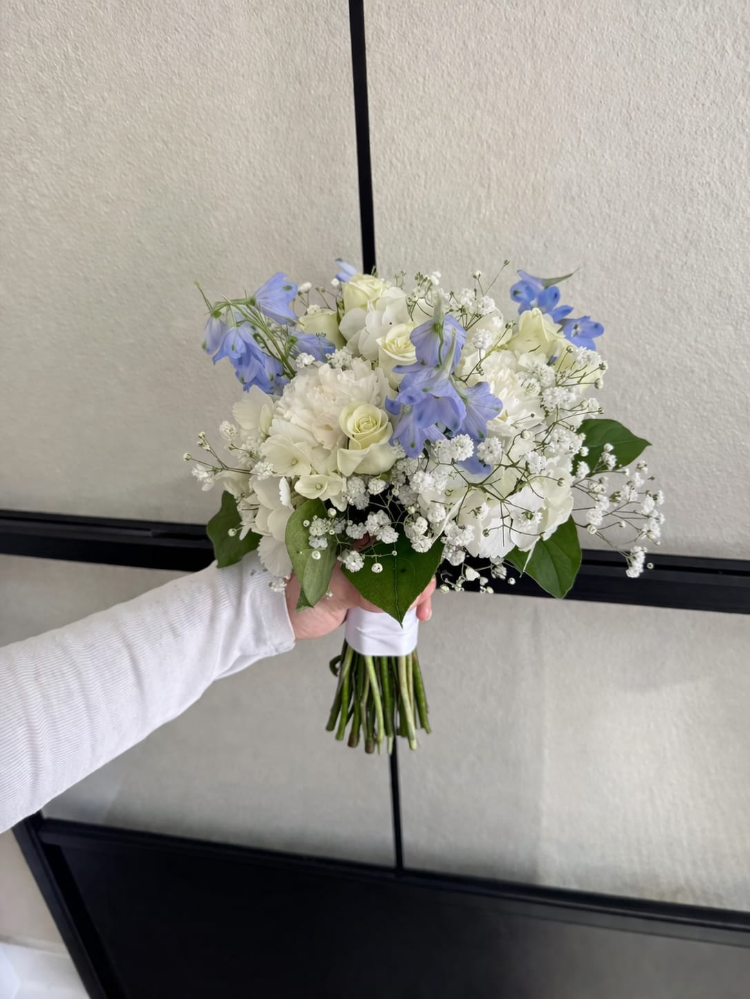Mini bouquet - A compact, hand-tied mini prom bouquet designed to complement formal wear. Perfect for prom, homecoming, or as a bridesmaid posy.  Made to sit comfortably in the hand and coordinate with formal attire, this mini bouquet is the kind of floral piece that makes the person wearing it feel celebrated and seen. We can personalize blooms to better match dress colors-please note premium flowers may carry an additional charge-so order in advance to ensure the best match and freshest stems.