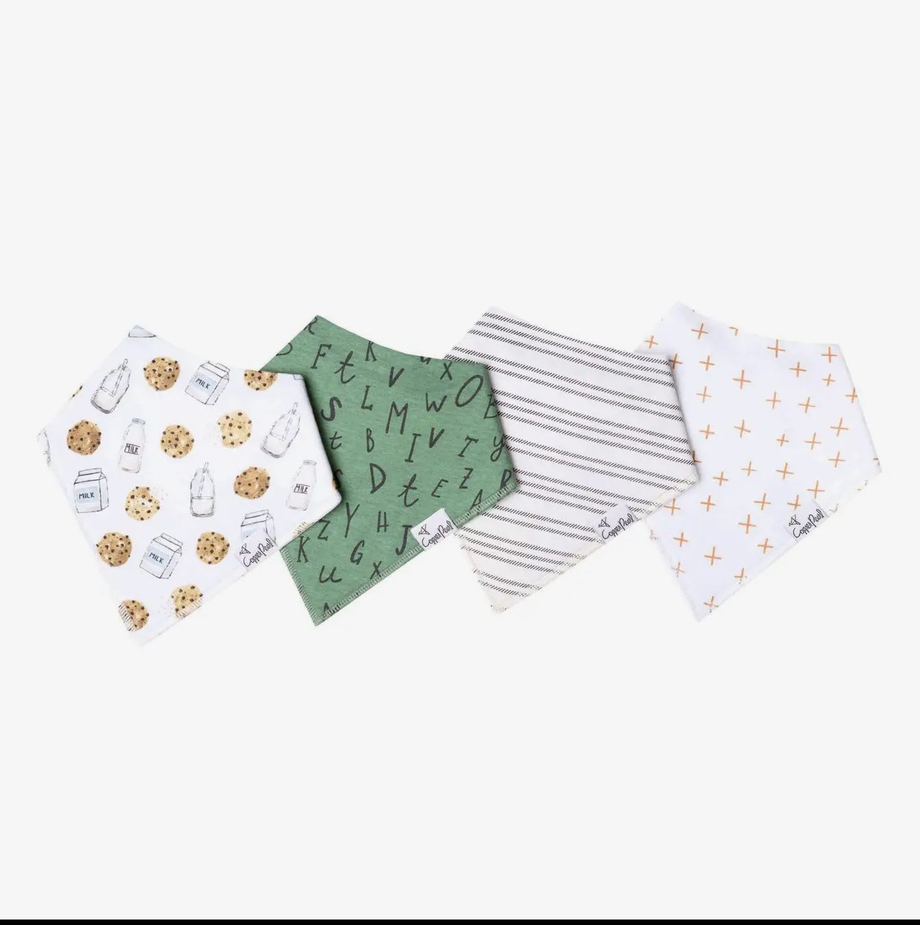 Four patterned baby bibs laid out on a white background