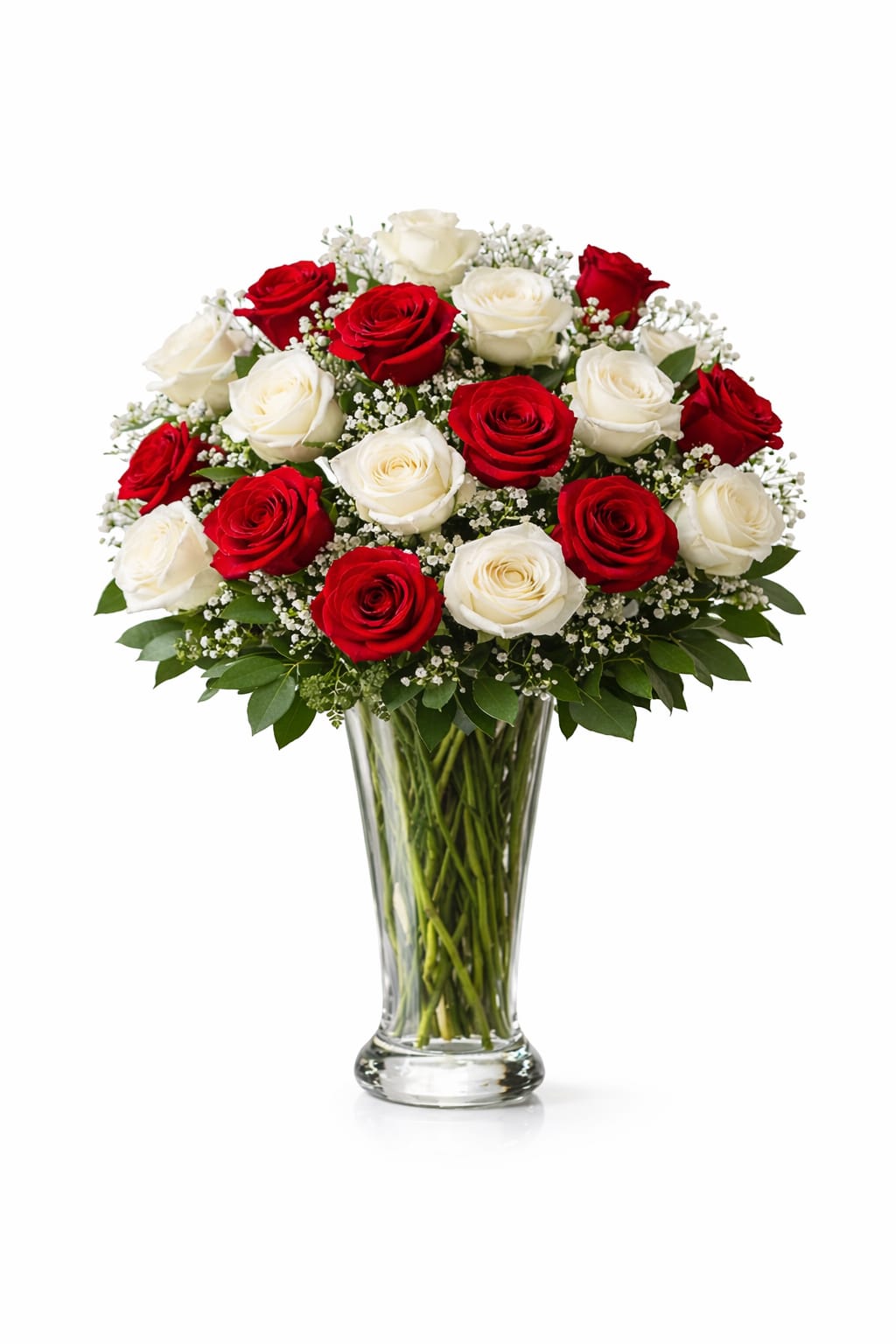 Red and white roses arranged in a clear glass vase