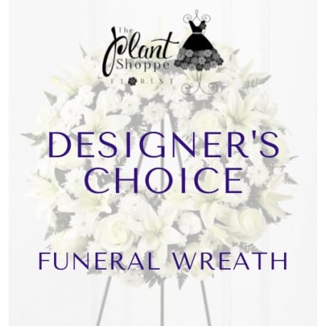 White funeral wreath on a stand with purple text overlay.
