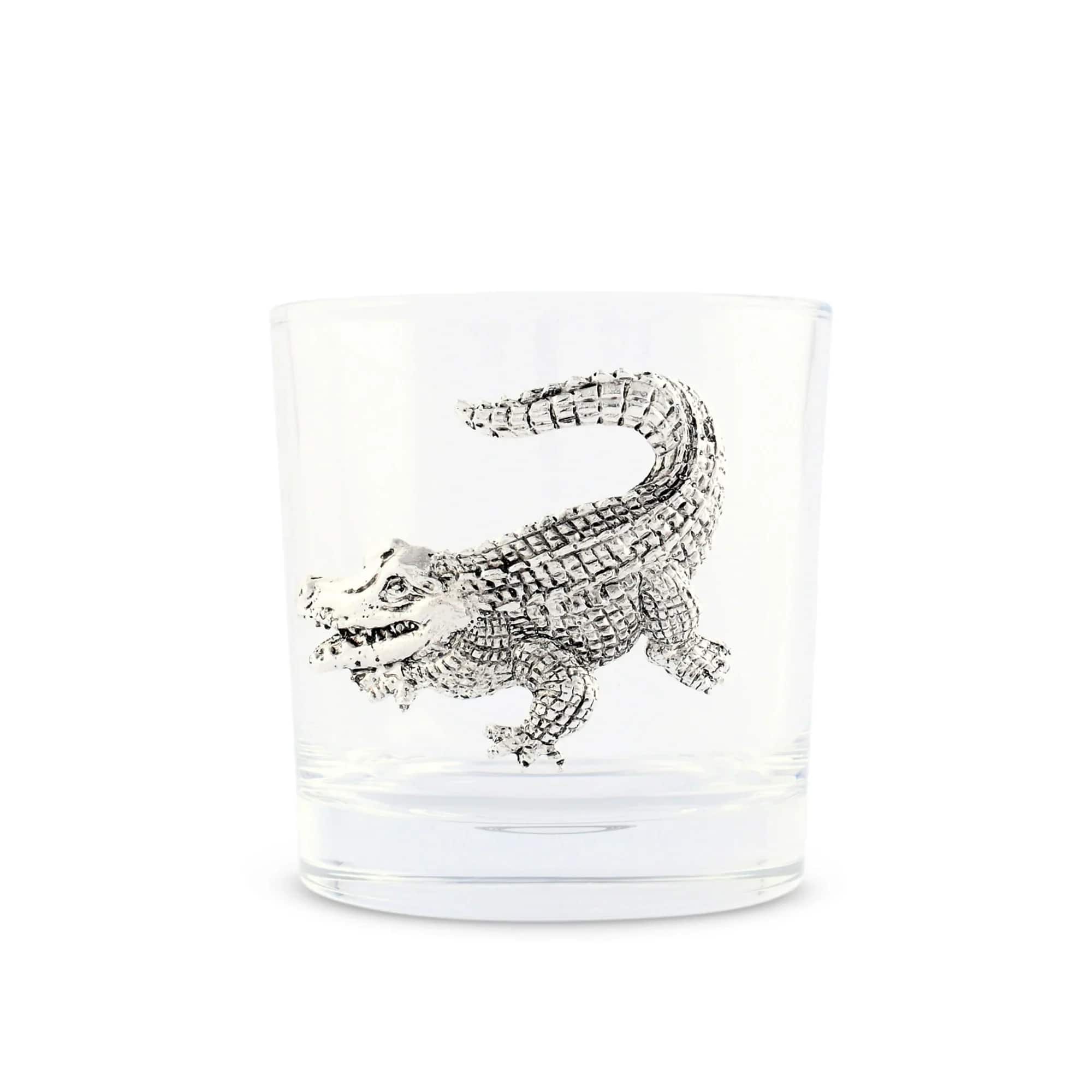 Clear glass tumbler with a silver crocodile design