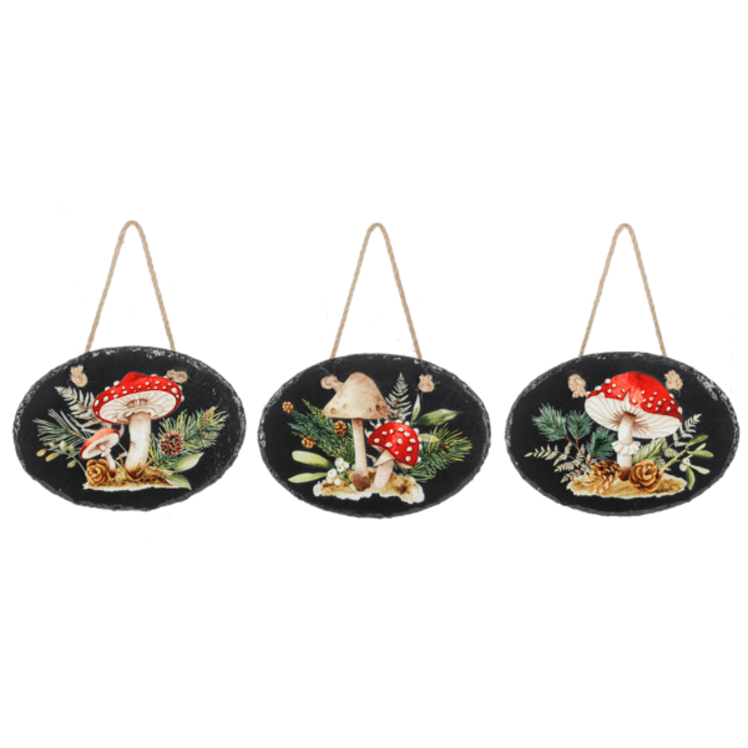 Three hanging oval plaques with mushroom and pine designs