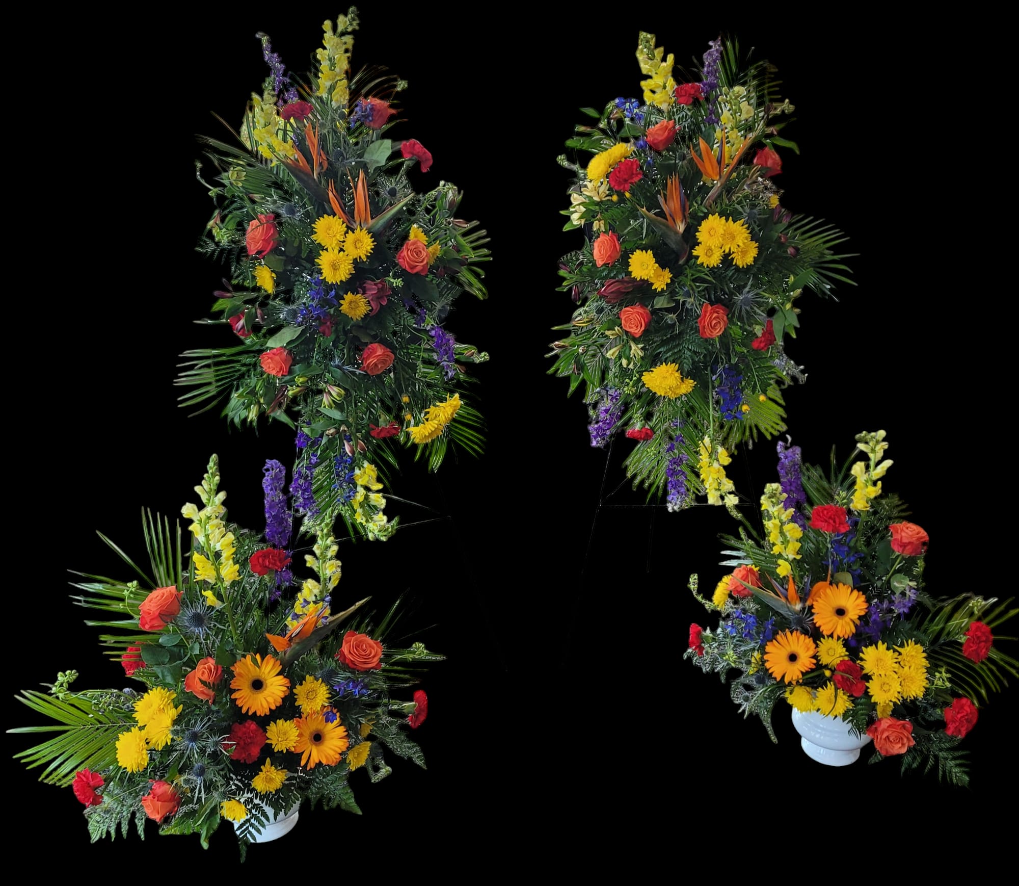 Four colorful floral arrangements with roses and daisies in white urns