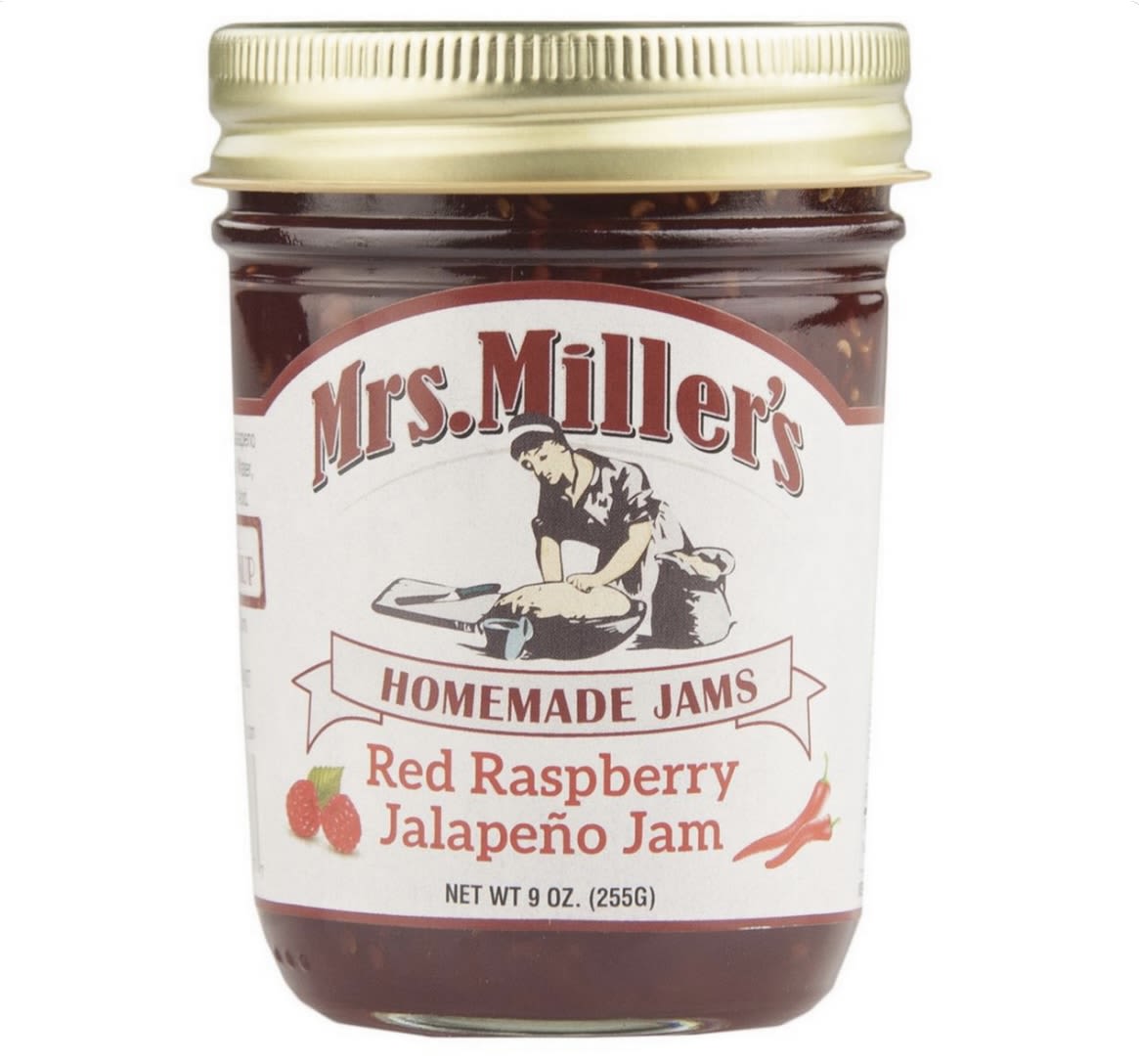 Jar of red raspberry jalapeño jam with a gold lid