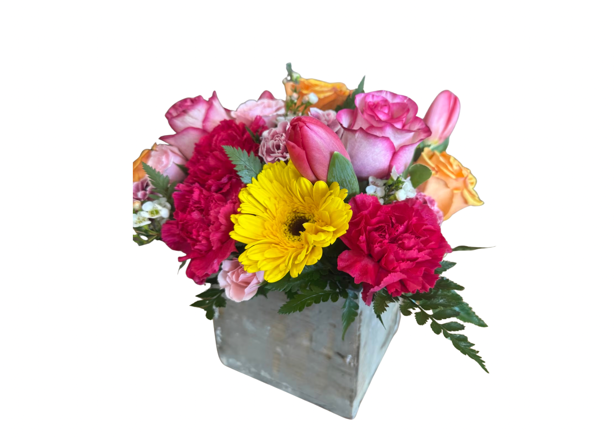 Mixed pink and yellow flowers in a square metal vase