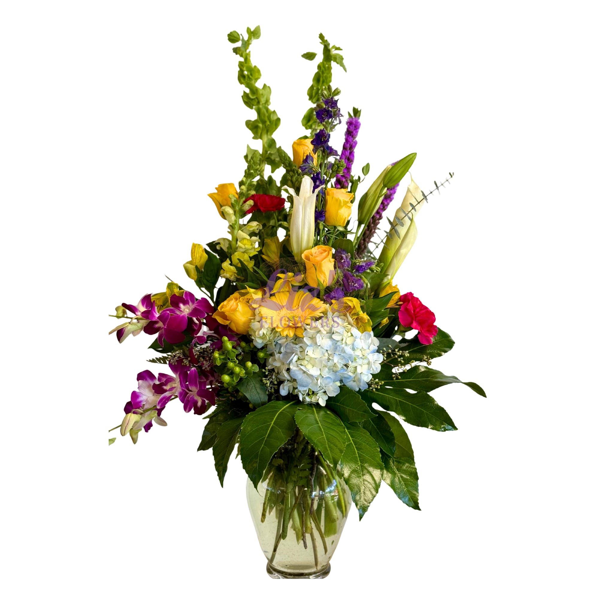 Tall mixed bouquet in a glass vase with orchids, roses, and hydrangeas