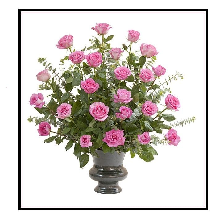 Pink roses arranged in a dark urn vase