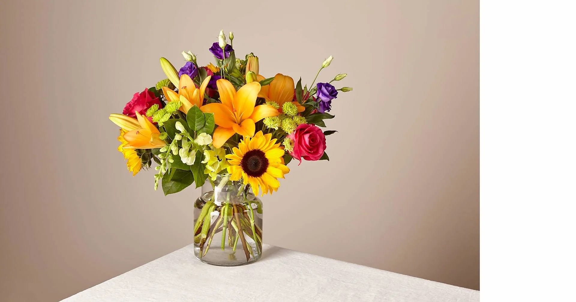 Best Day Bouquet - Make this day their best day. Our local florist handcraft a colorful array of flowers in a clear glass vase to create a celebration in bloom. Perfect to give for a special reason or to simply share a smile.
