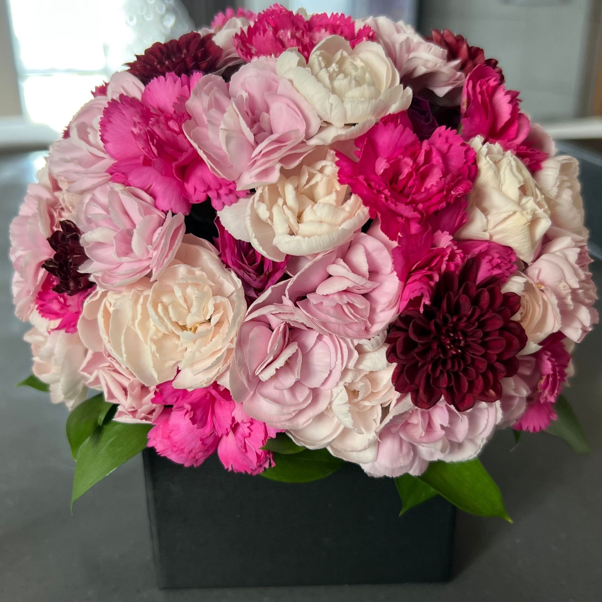 Gorgeous Centerpiece - Mixed flowers in a low vase (included)