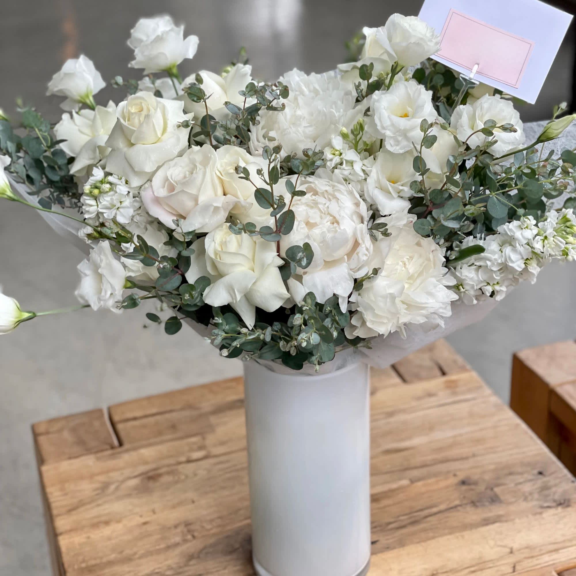 Pure Elegance Bouquet in a vase  - Roses, 5 Peonies, Lisianthus, Stock mixed with Eucalyptus in a vase 