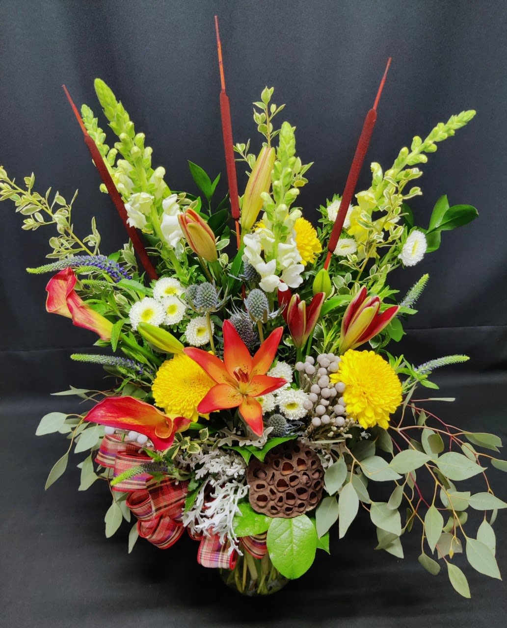 Fall mix of premium flowers and lotus - Tall fall harvest bouquet.  Colors, items and container may vary.  Order well in advance for best selection.  Perfect for a fall anniversary gift or your fall open house event.