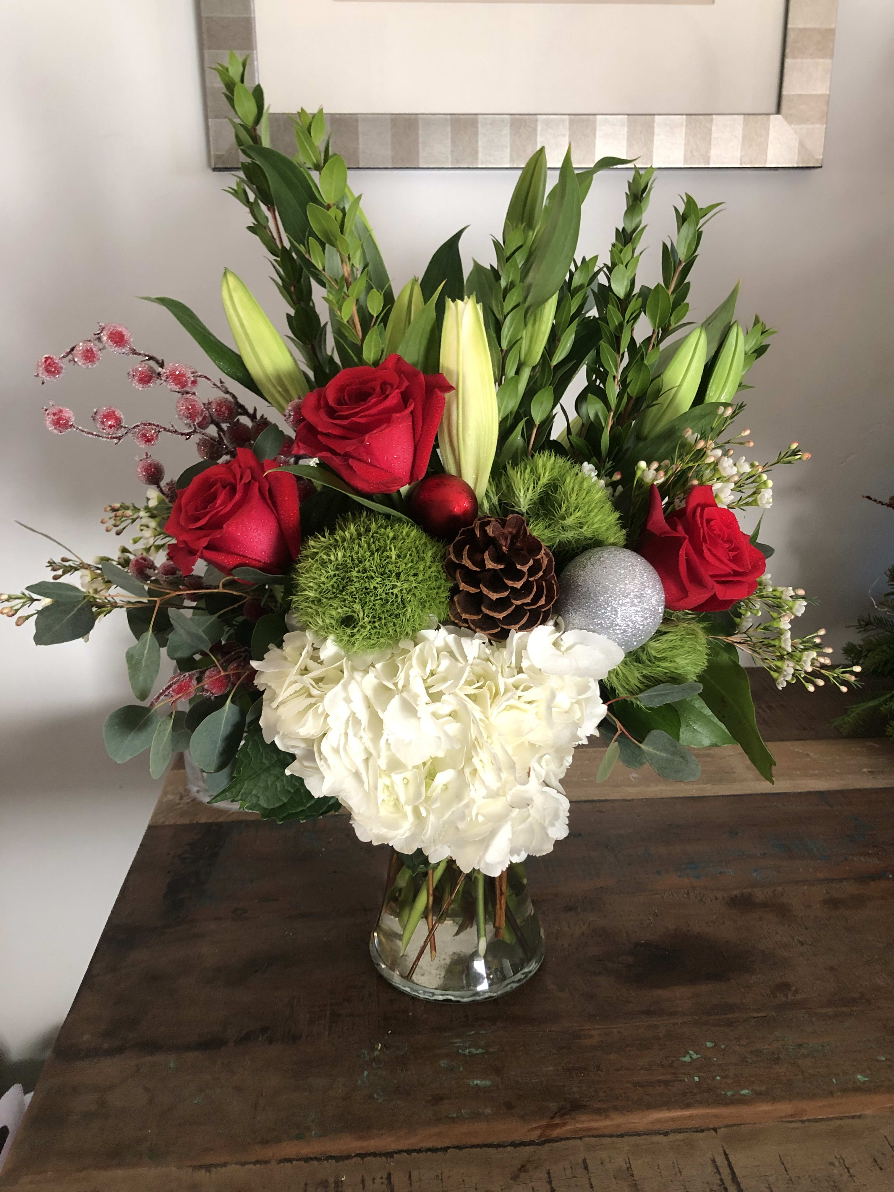 Merry and Bright - Hydrangea, red roses, evergreen and green ball dianthus and lilies 