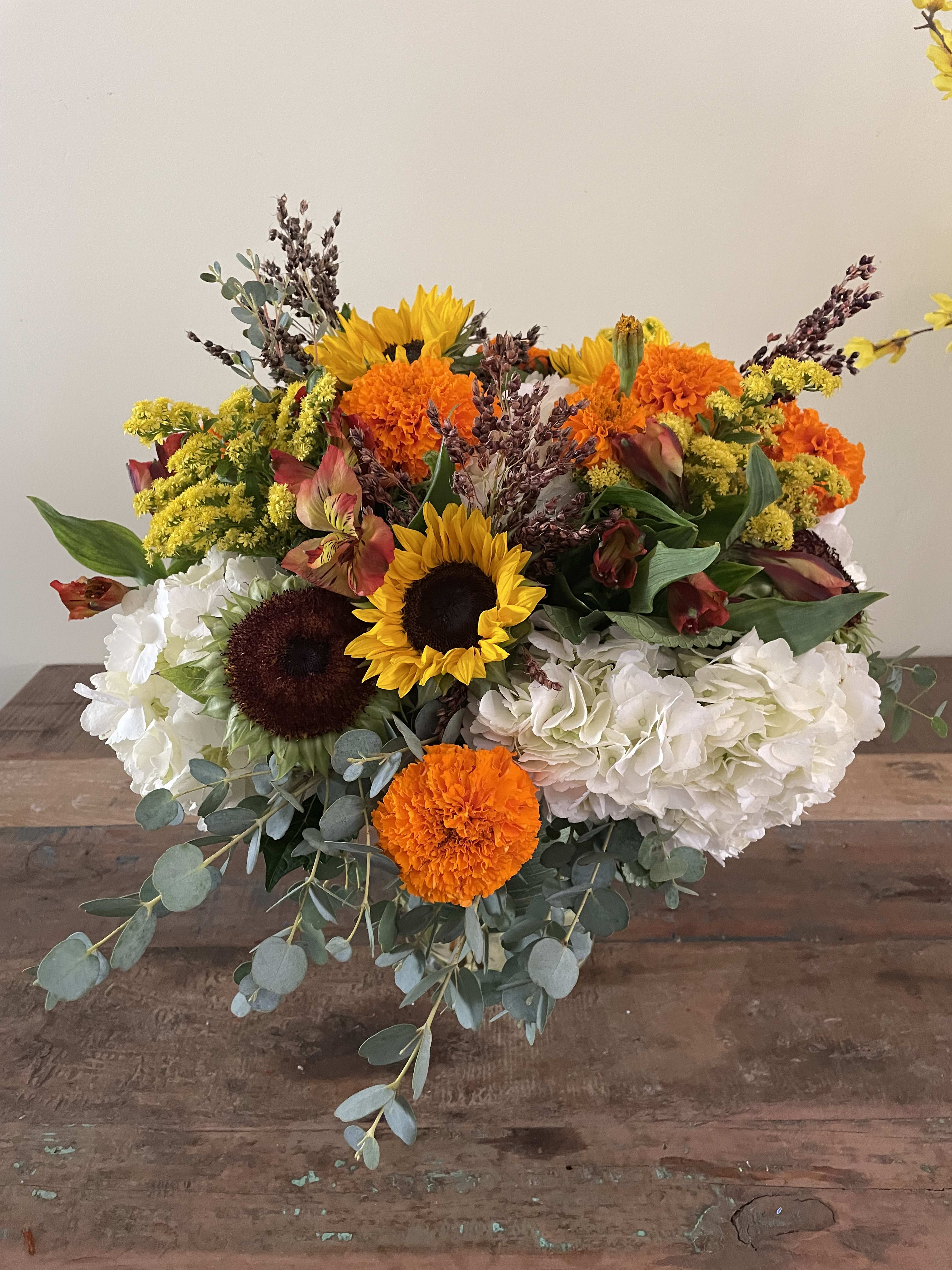 Happy days - Hydrangea, sunflowers, marigolds, orange alstromeria sure to brighten anyone’s day!