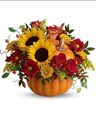 Pumpkin-shaped arrangement with sunflowers, red roses, and autumn mums