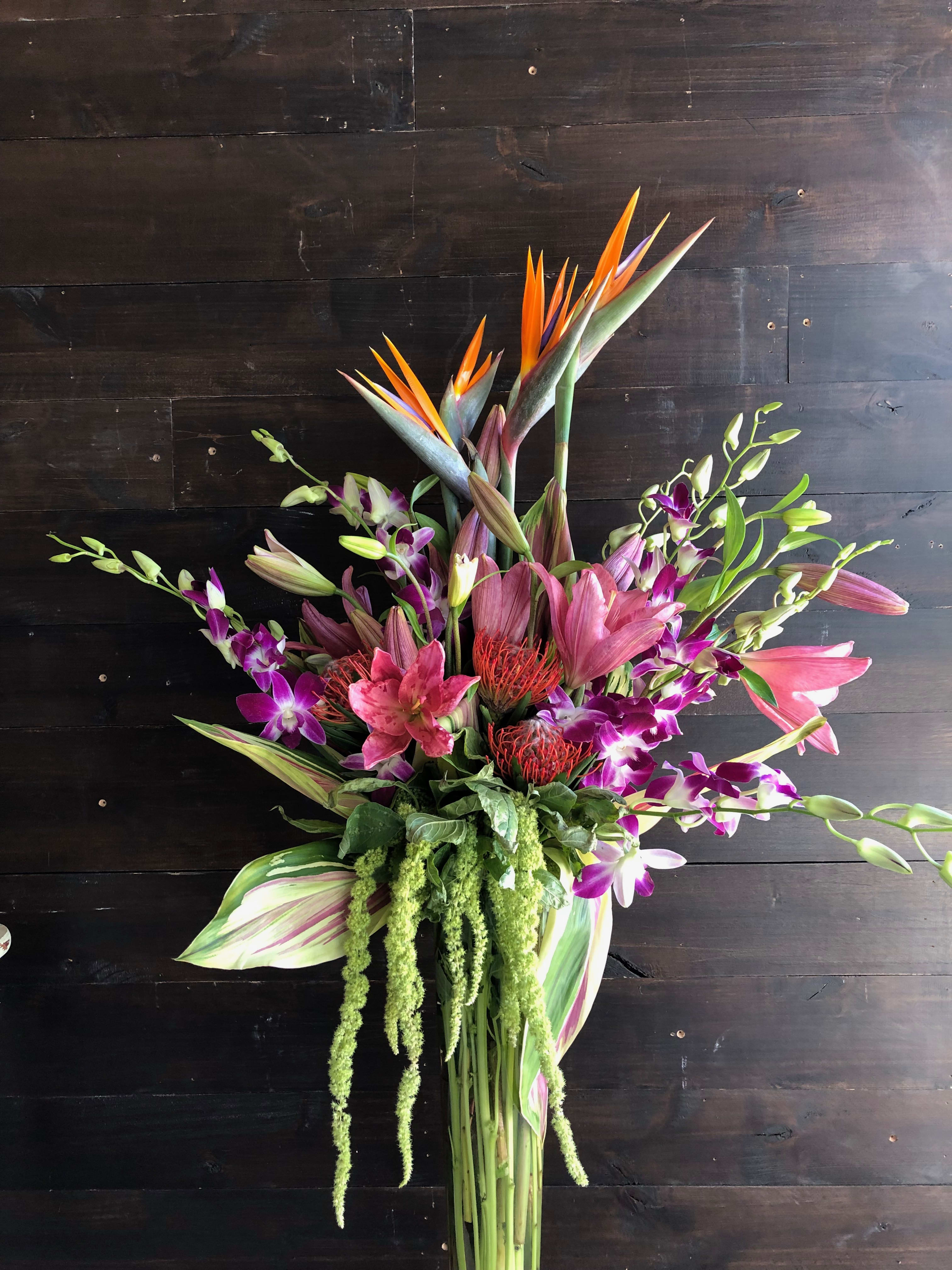 Kona Love.  - ****THIS DESIGN NEEDS A WEEKS NOTICE****  NOT AVAILABLE AS A VALENTINE'S DAY ORDER. PLEASE SEE OUR SPECIAL VALENTINE'S DAY MENU FOR DESIGN OPTIONS.   Beautiful tall Tropical centerpiece. An amazing WOW gift.  ****Not available for same day delivery.**** 