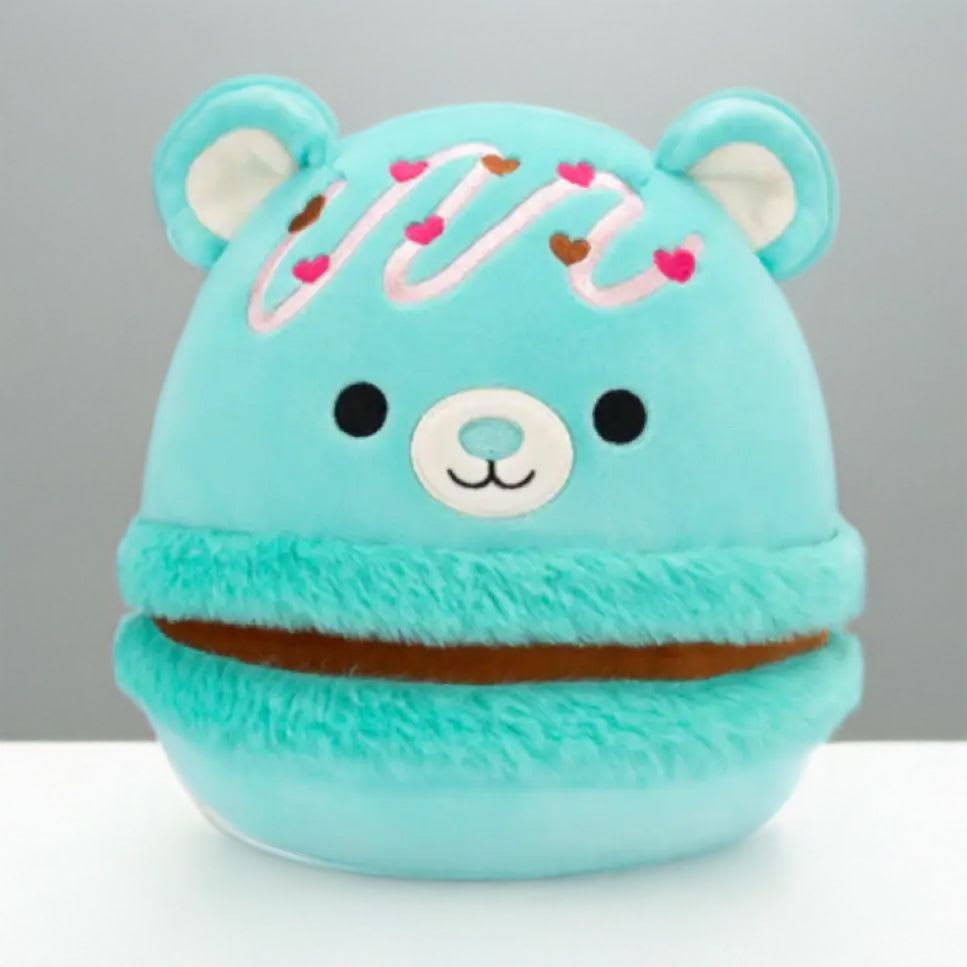 Turquoise plush bear with a smiling face and heart decorations