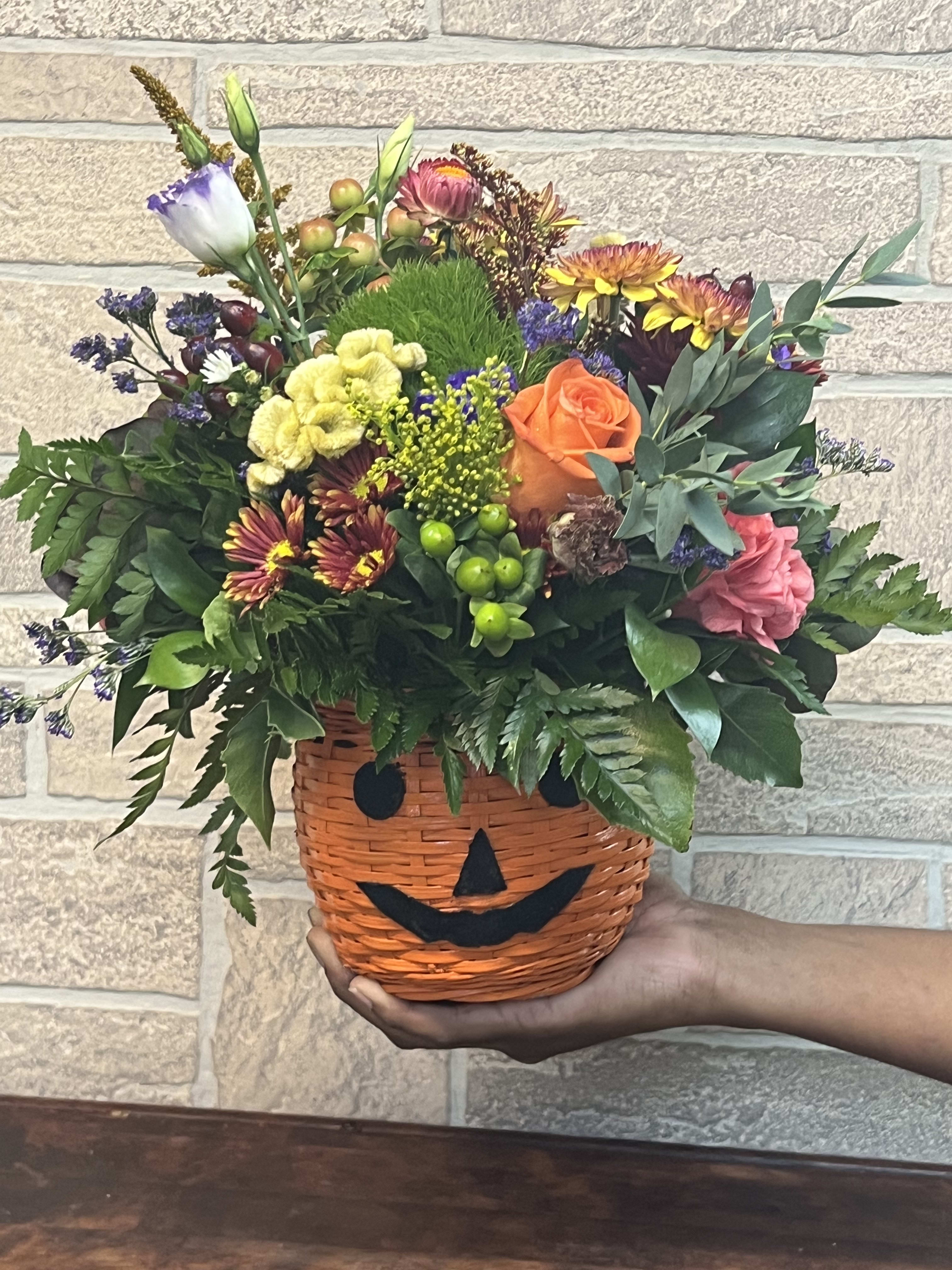 Jackie O'Lantern *Limited Edition*  - A fresh seasonal mix of cut flowers designed in a vintage Jack O'Lantern decorative basket 