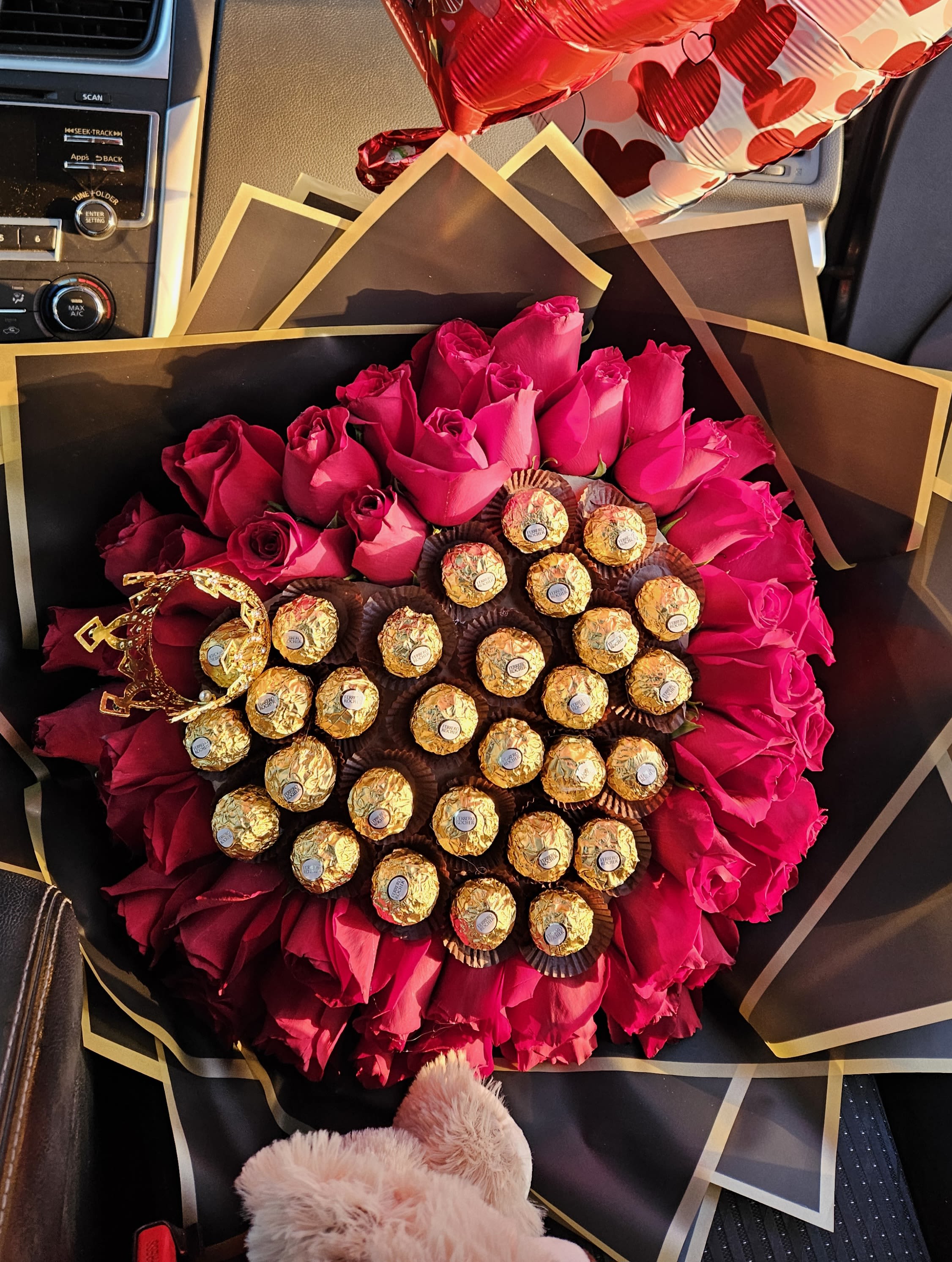 Bouquet of hot pink roses with Ferrero Rocher chocolates and a gold crown