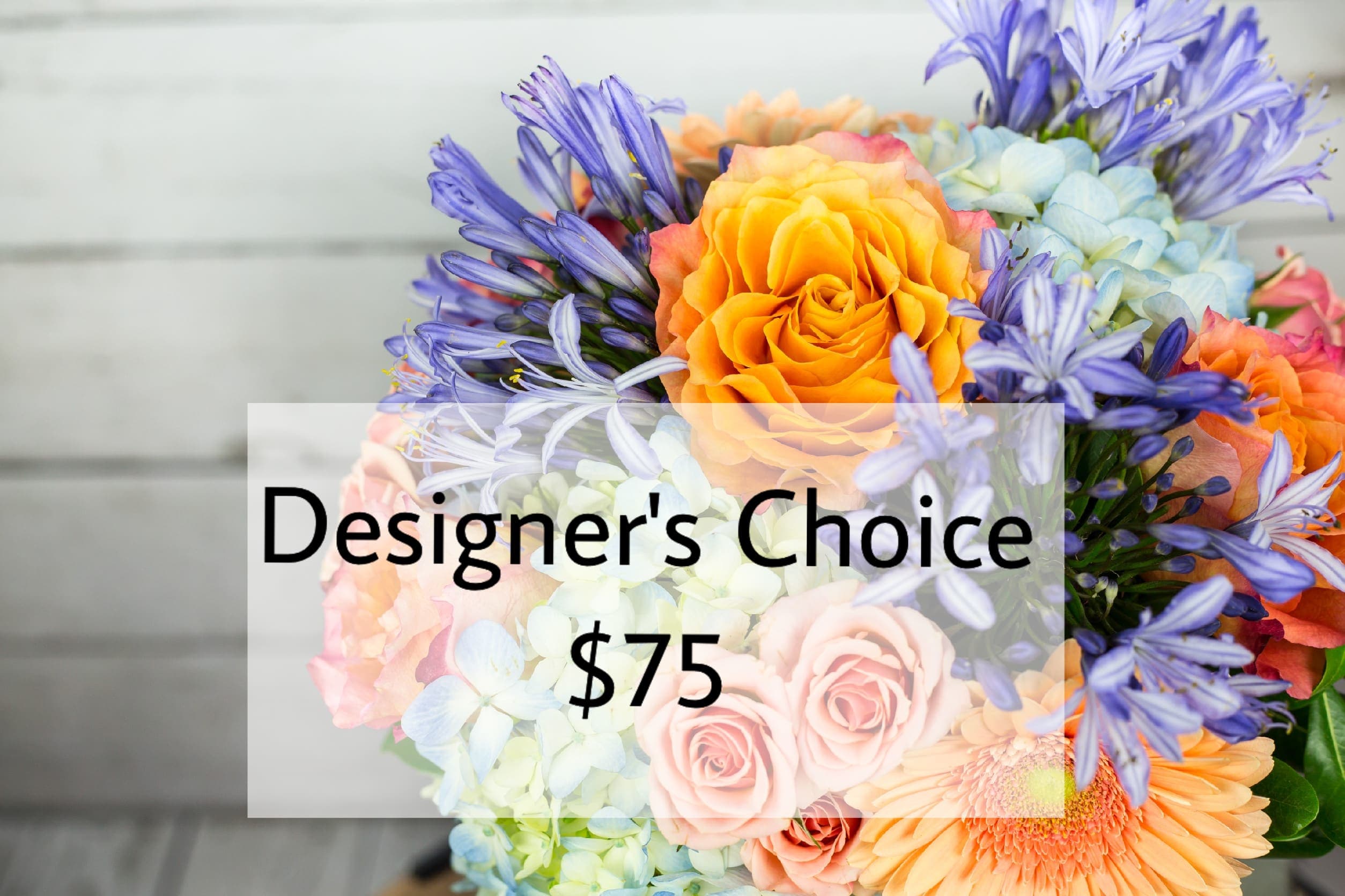Mixed bouquet with orange roses, blue hydrangeas, and purple flowers