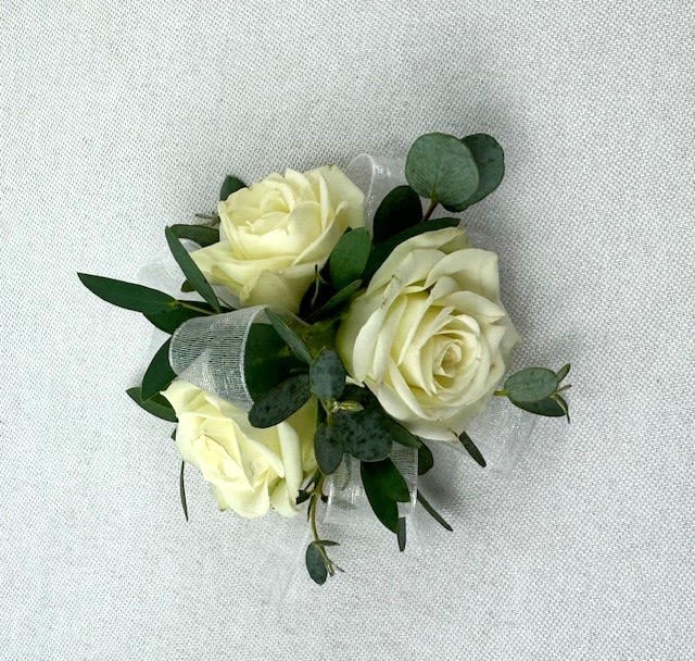 Small bouquet of cream roses with greenery and ribbon