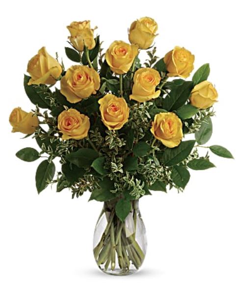 Yellow roses arranged in a clear glass vase
