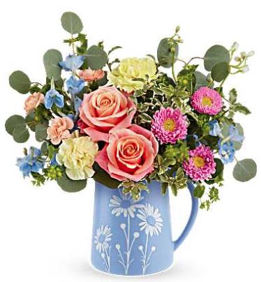 Daisy Dreams - Brimming with fresh-picked charm, Teleflora's Daisy Dreams Bouquet delights with peach roses, yellow carnations, and cheerful blooms arranged in a food-safe blue pitcher adorned with a sweet white daisy design.