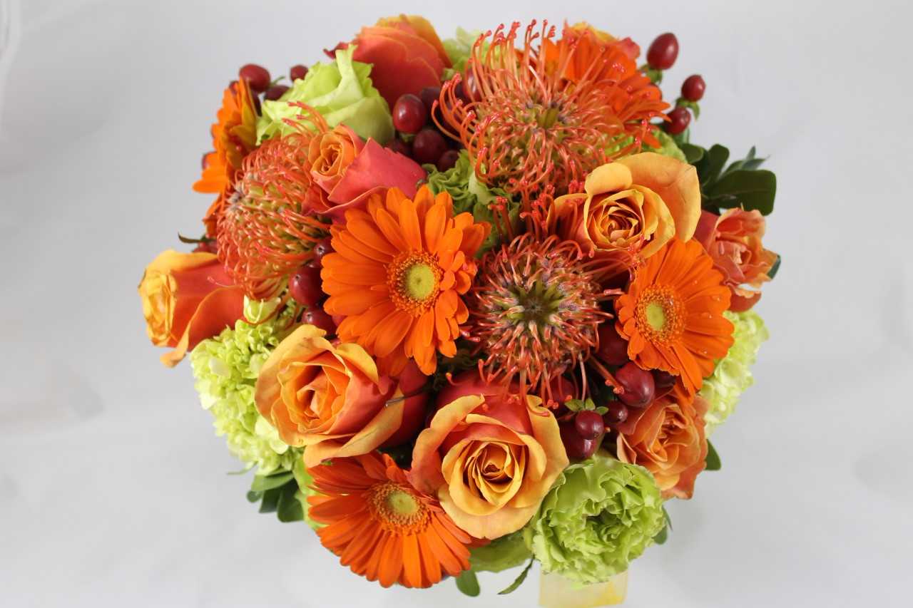 Orange and peach bouquet with gerbera daisies and roses