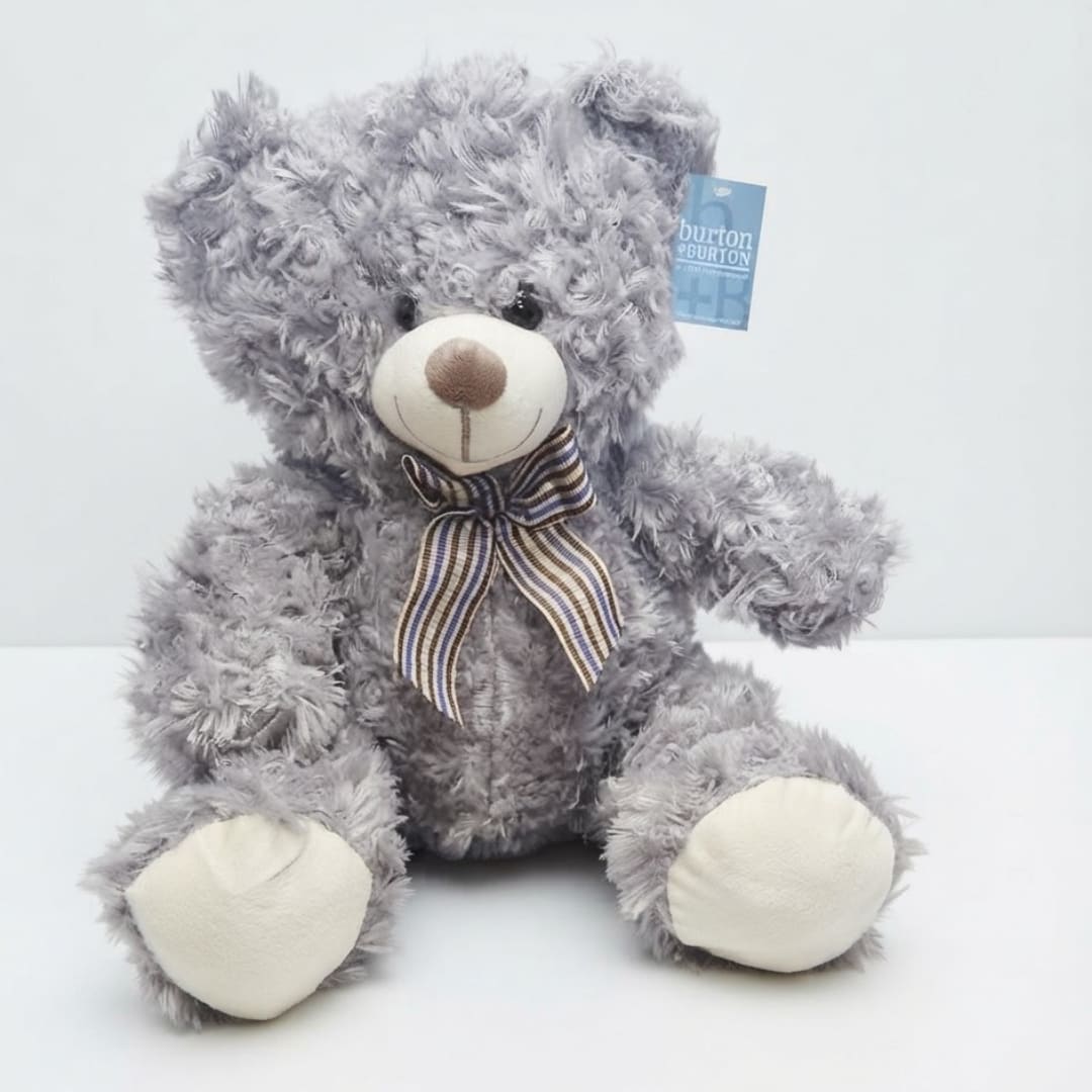 Gray plush teddy bear with a striped ribbon bow