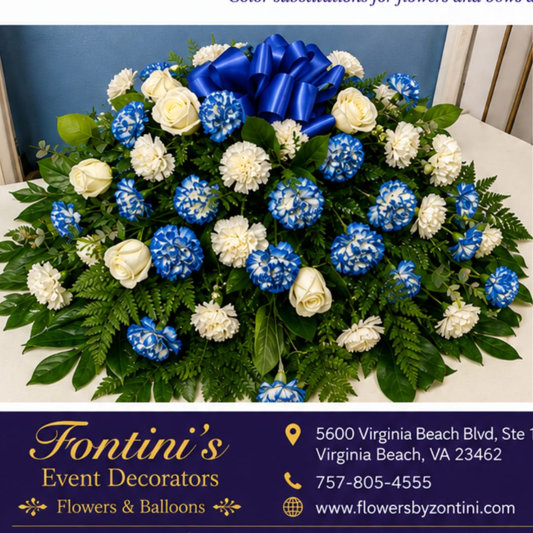 Blue and white floral arrangement with a large blue bow