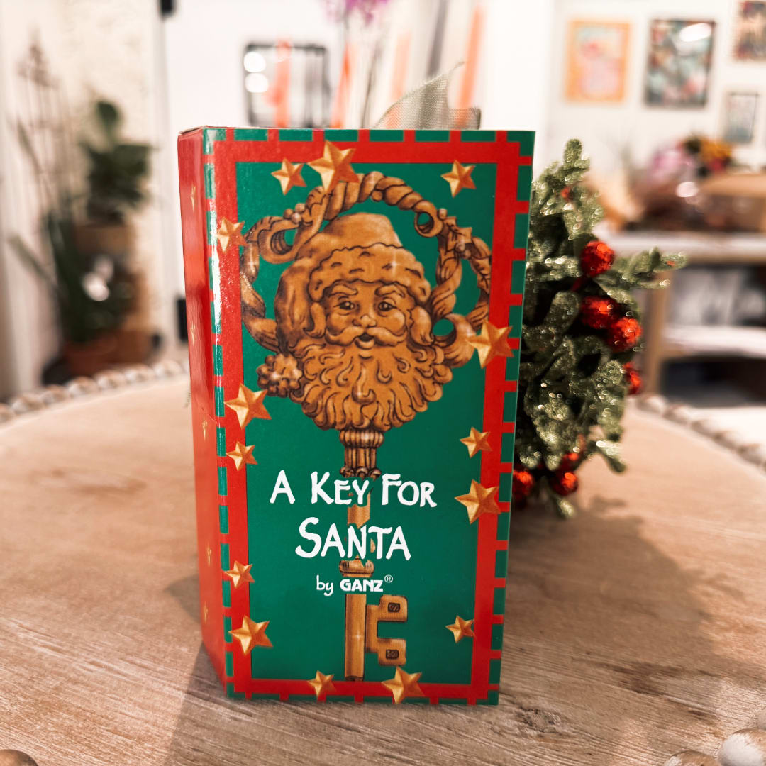 Holiday gift box labeled "A Key For Santa" with a decorative Santa face