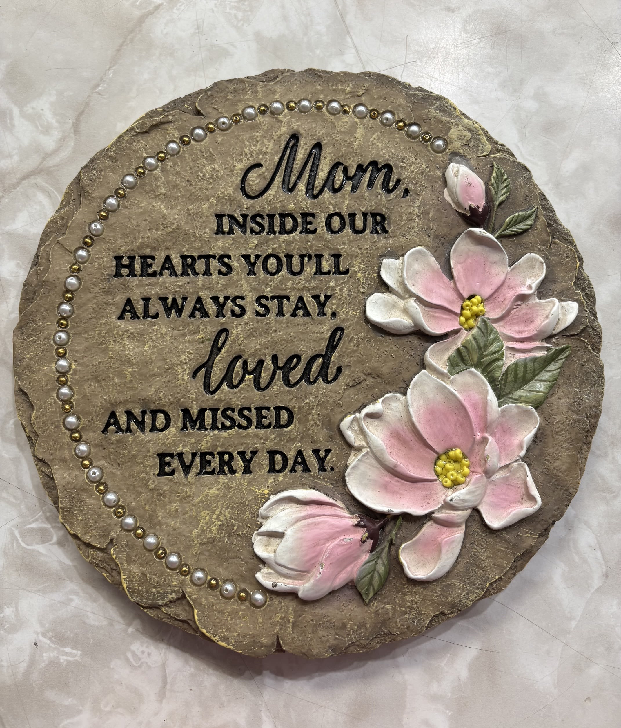 "Mom" Sympathy Garden Stone - This beaded garden stone comes with an image of flowers and a commemorating phrase: "Mom, Inside our Hearts you will Always Stay, Loved and Missed Everyday"  9" x 9"
