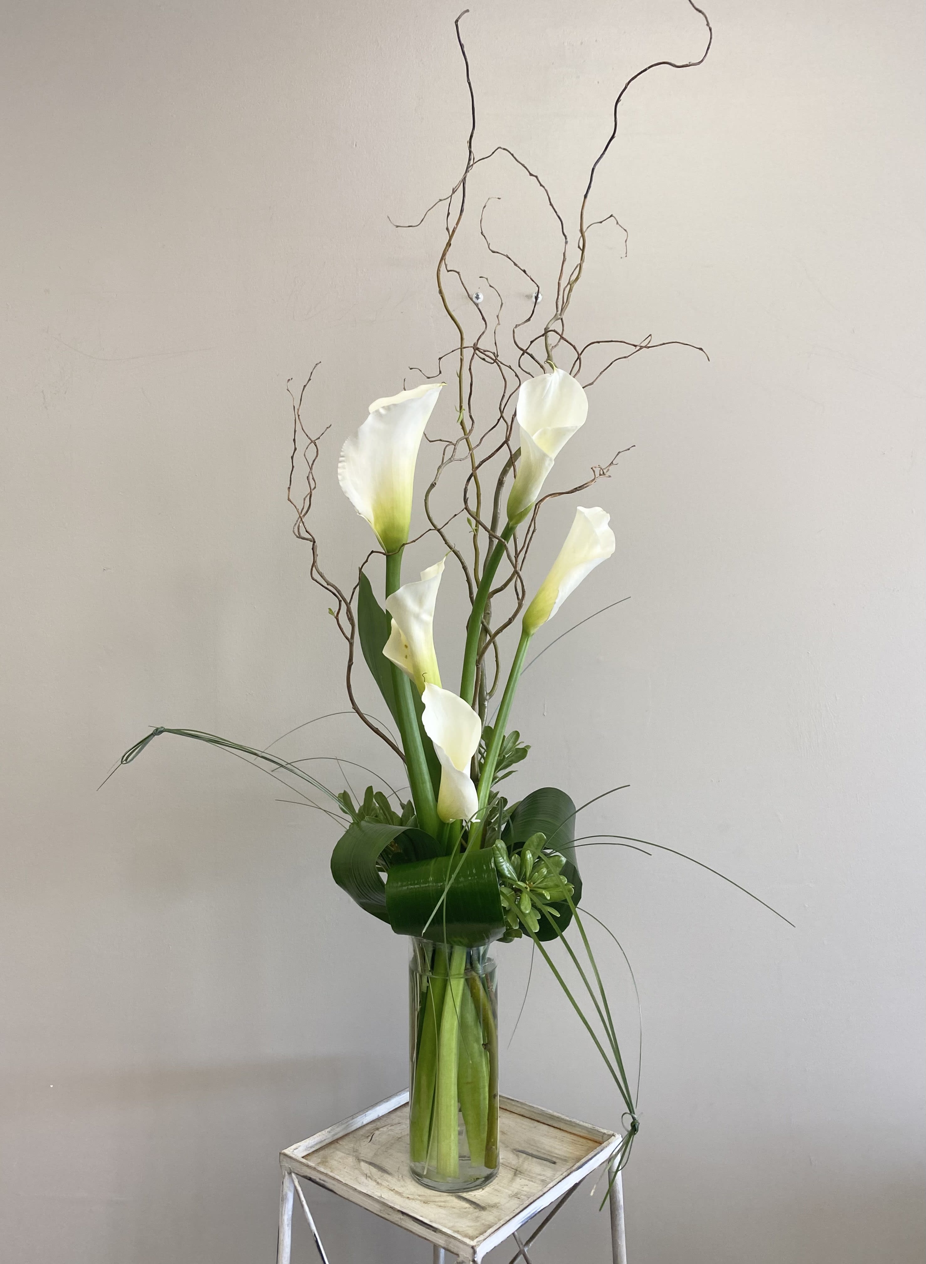 Calla Lily Beauty  - A modern twist on the classic beauty; white calla lilies. Other colors can sometimes be acquired, if you would like a different color put that in the floral note and we will let you know if we're able to get it.