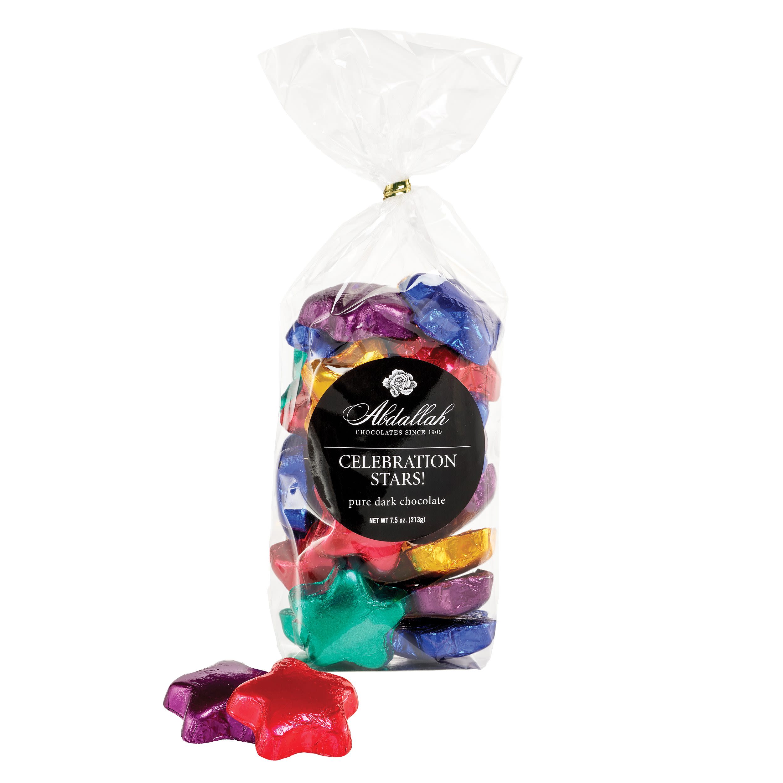 Bag of colorful star-shaped chocolates with two pieces in front