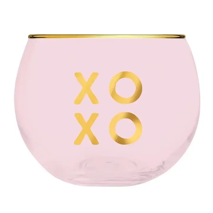 Pink glass bowl with gold rim and XO lettering