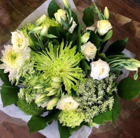 Hand-Tied Bouquet #3 - Fresh and serene, this soft green and white arrangement features striking green spider mums, delicate lisianthus buds, white chrysanthemums, creamy roses, and Queen Anne's lace. Nestled in rich greenery, this bouquet exudes natural beauty and calm sophistication.
