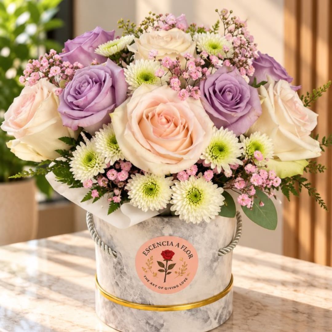 Bouquet of lavender and blush roses in a marble-look hat box