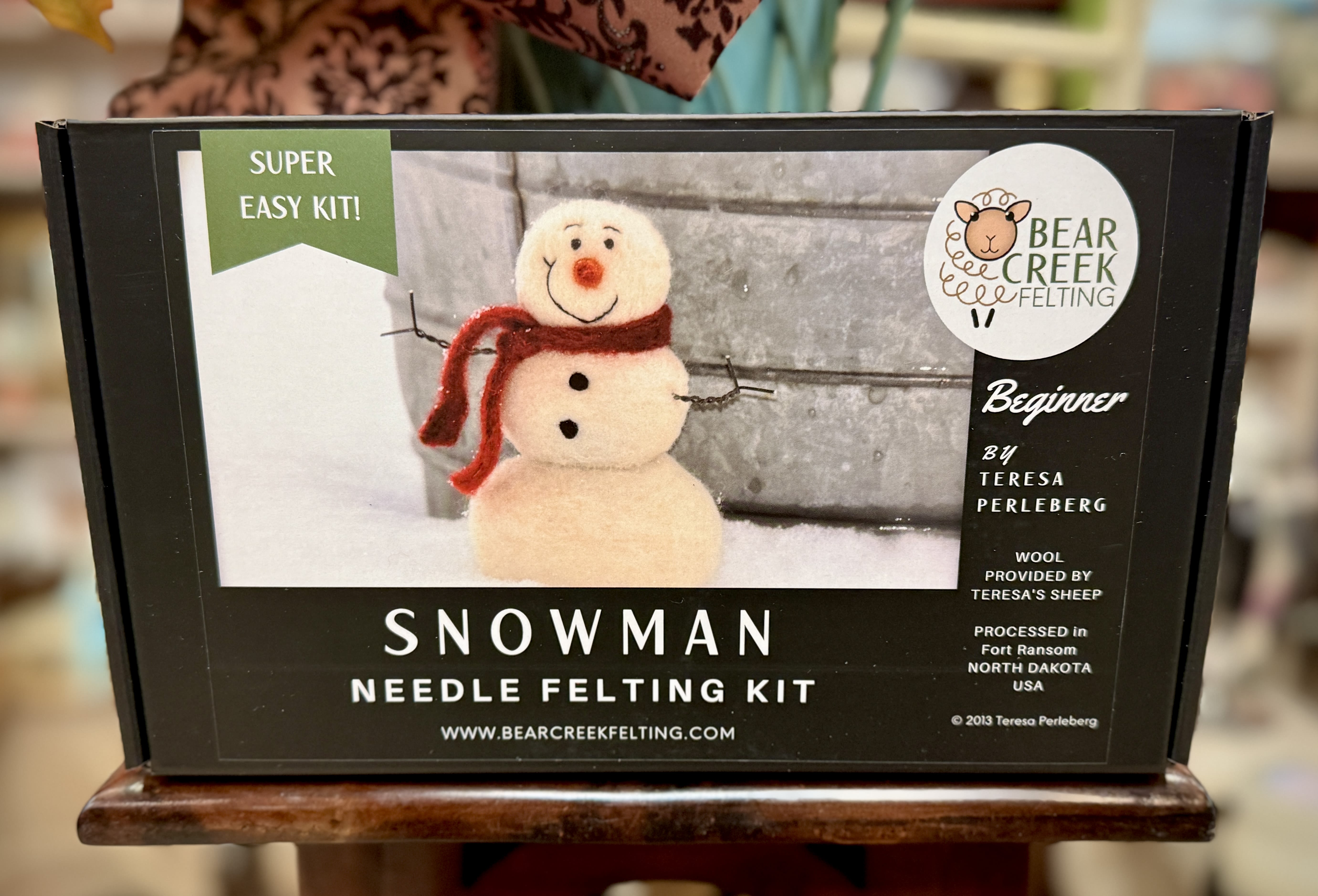 Boxed snowman needle felting kit with a felt snowman on the front