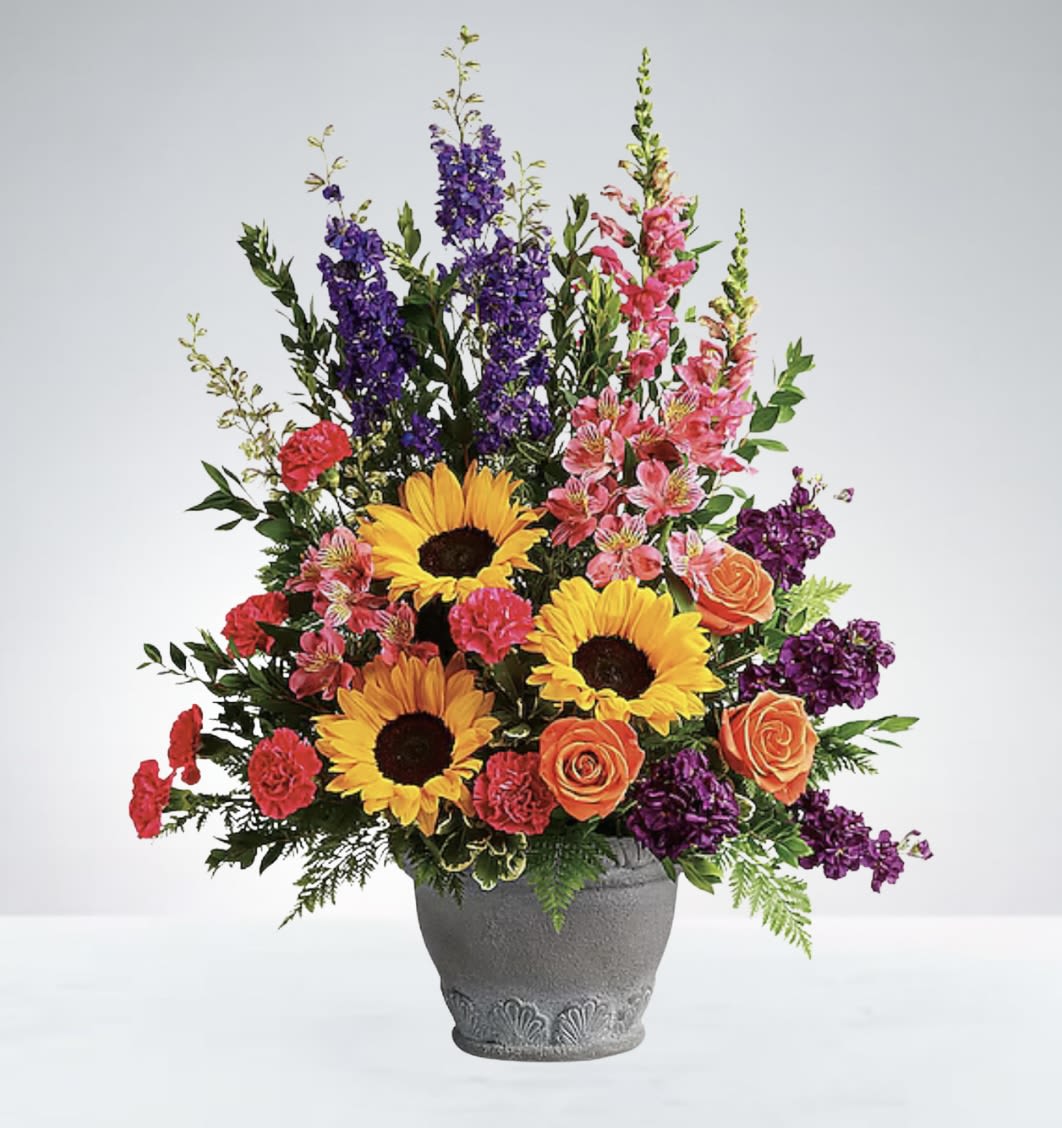 Colorburst Blooms - A vibrant basket filled with a lively mix of colorful flowers, bringing joy and brightness to any space or occasion. DISCLAIMER: Vase may be replaced if needed to. 