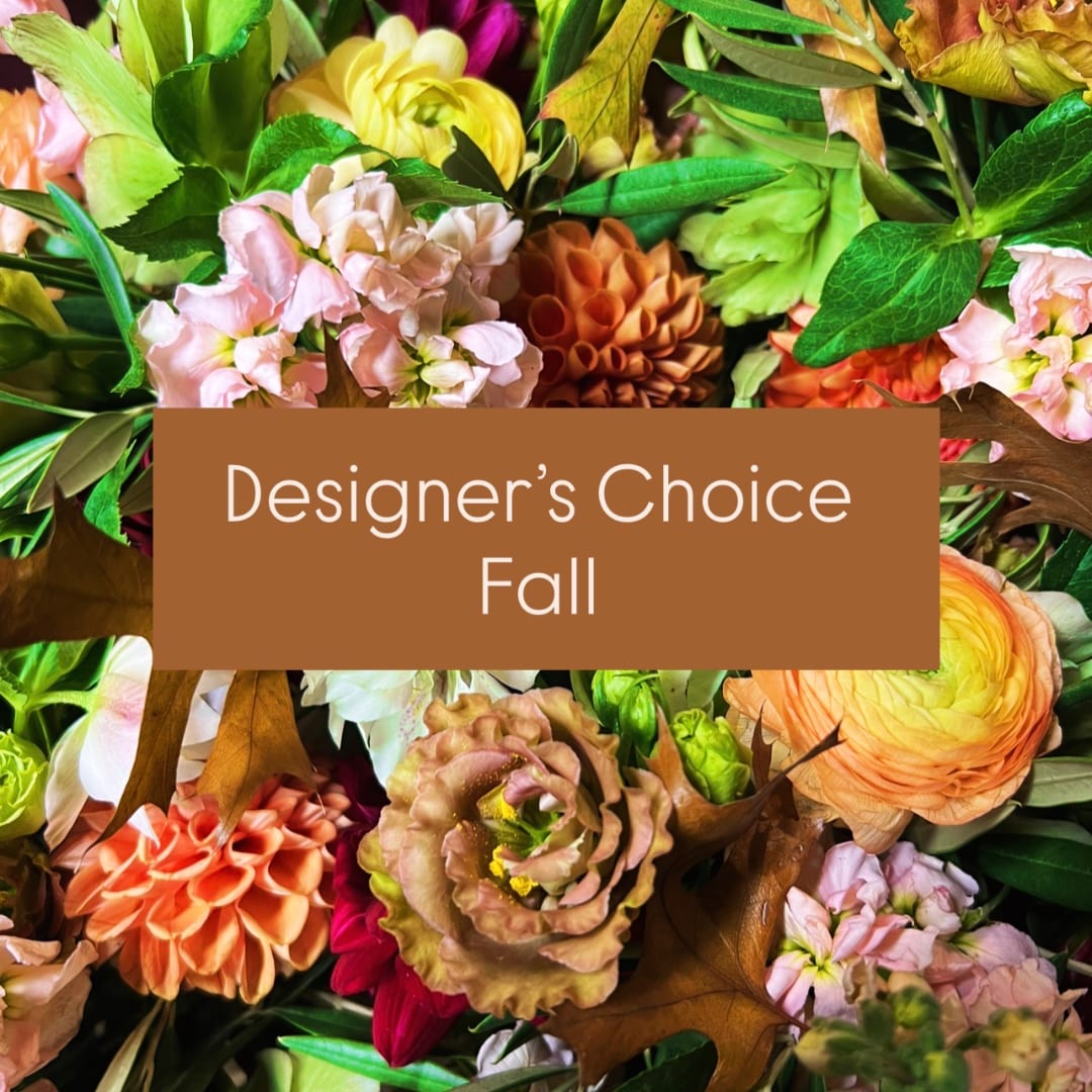 Fall floral arrangement with mixed blooms and a designer's choice sign