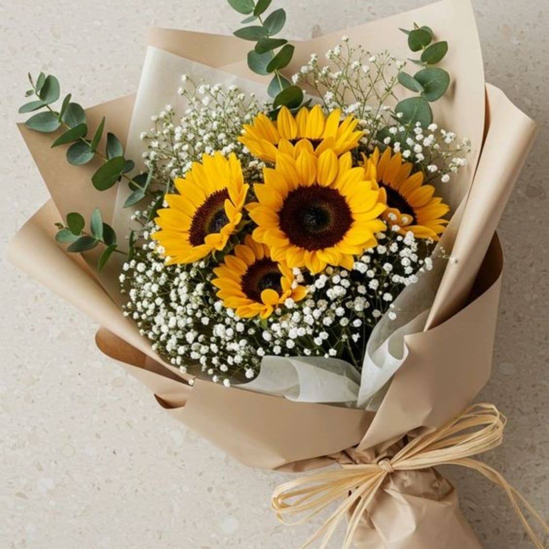 Bouquet of sunflowers with baby's breath wrapped in beige paper