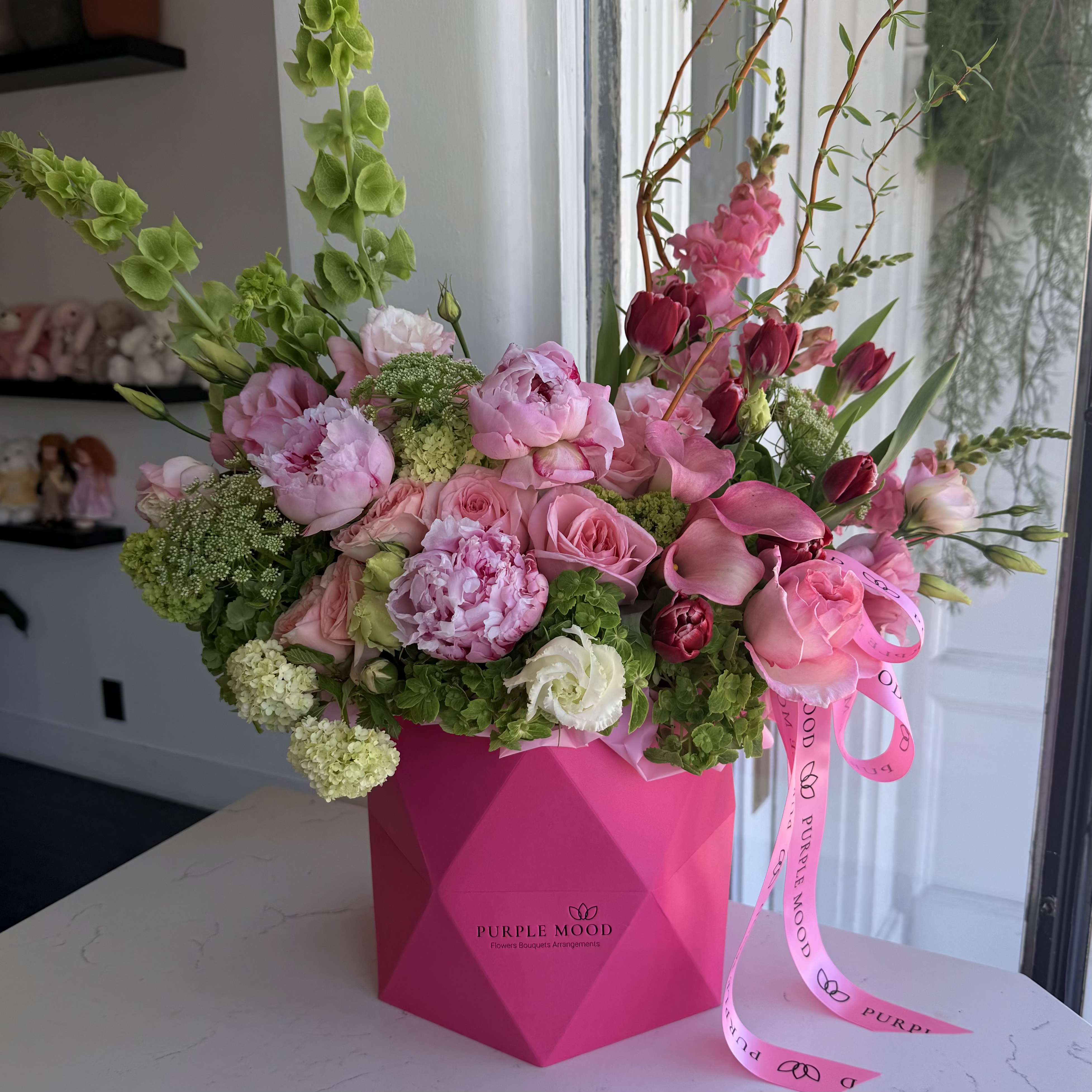 Spring Breeze Box - Fresh, vibrant, and full of life — the Spring Breeze arrangement captures the joyful spirit of the season. With its mix of lively pinks, greens, and pops of red, it’s a cheerful design that instantly brightens any space. 